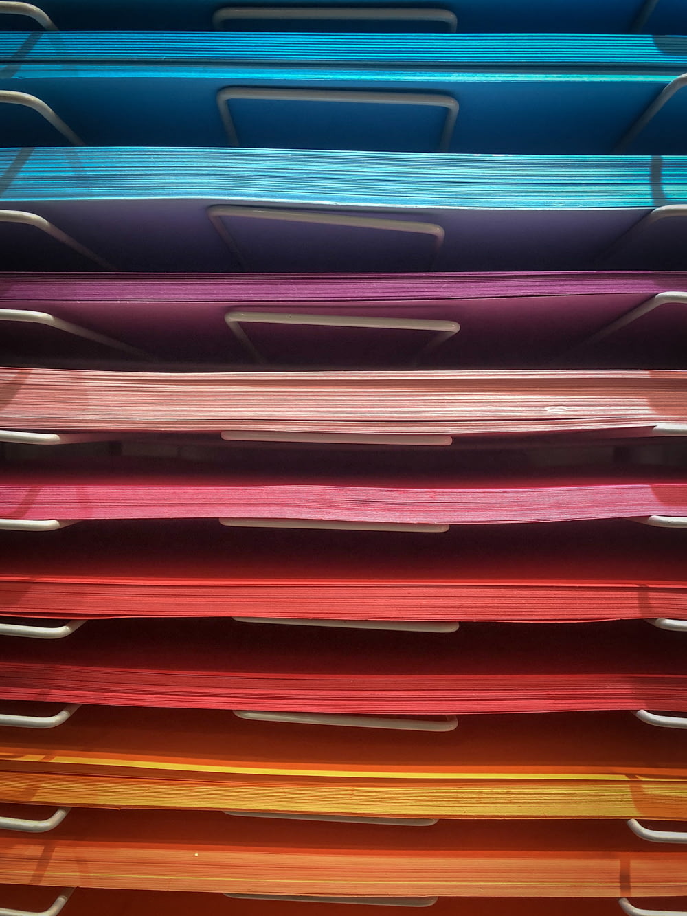 pile of assorted-color papers