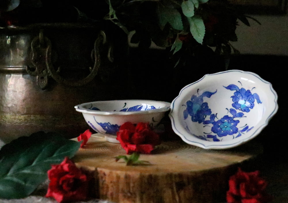 two round white-and-blue floral ceramic bowls