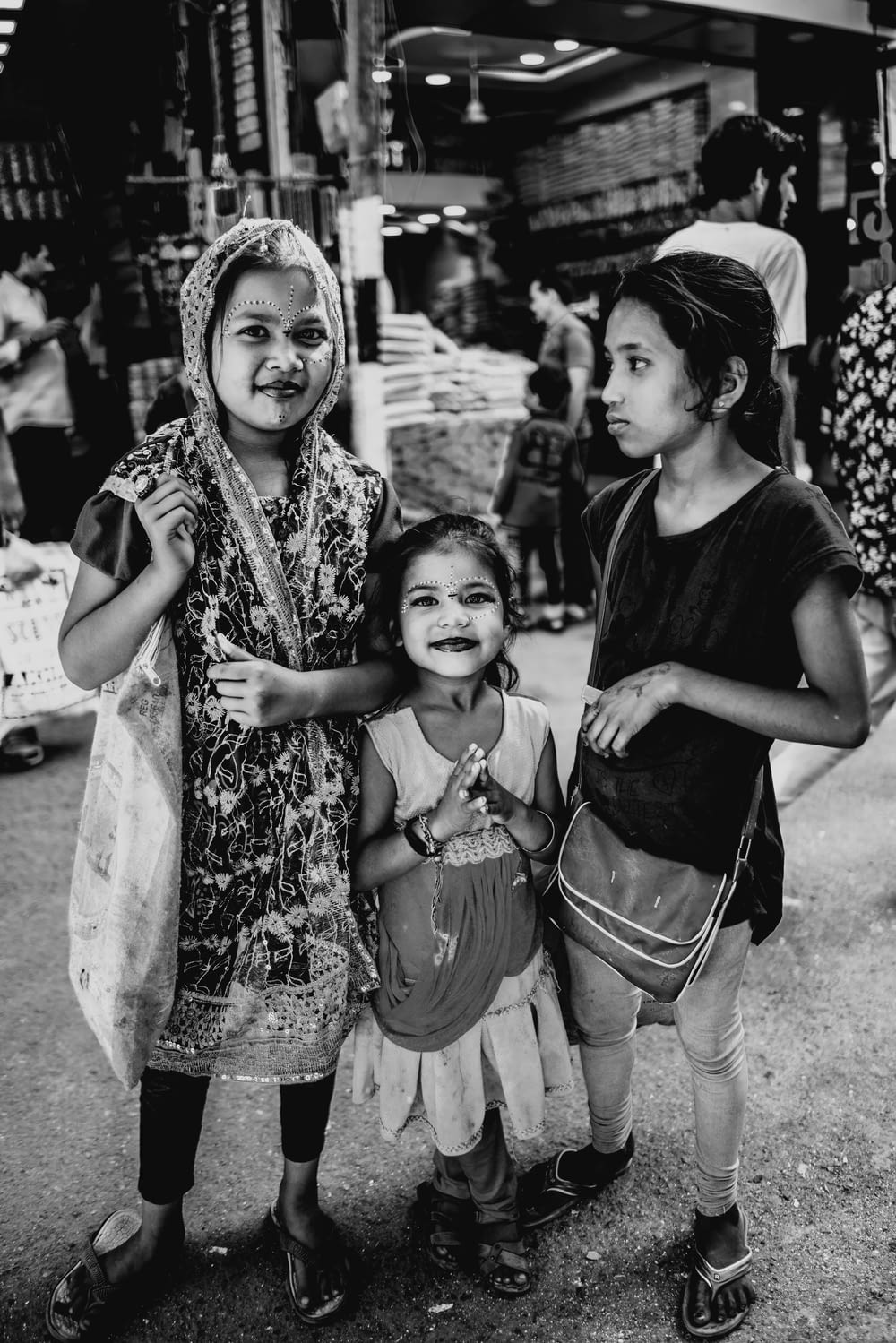 grayscale photography of three girls