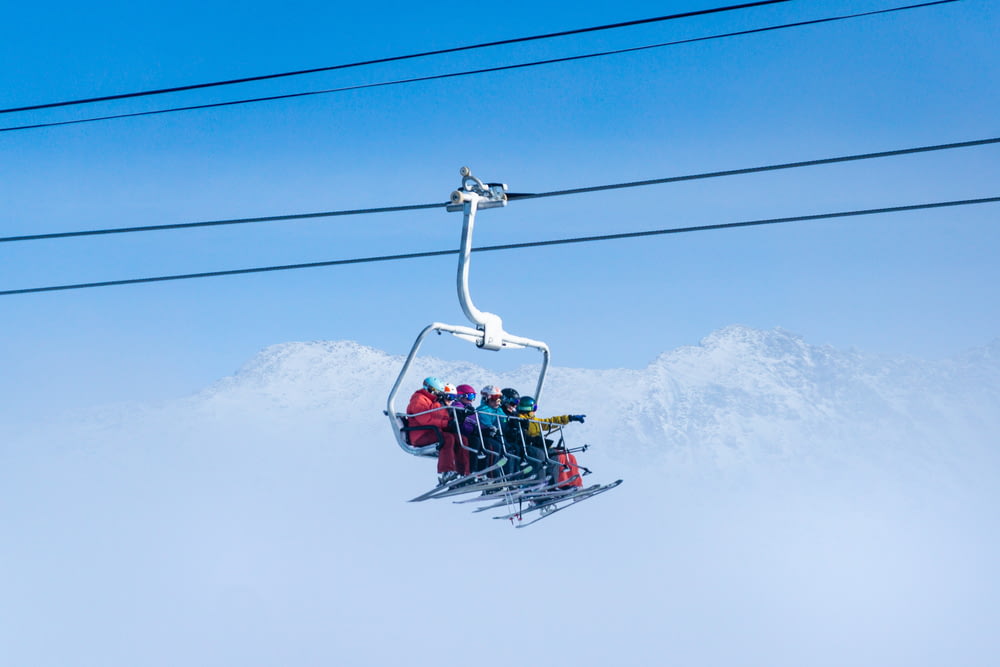 people riding on cable car during daytime