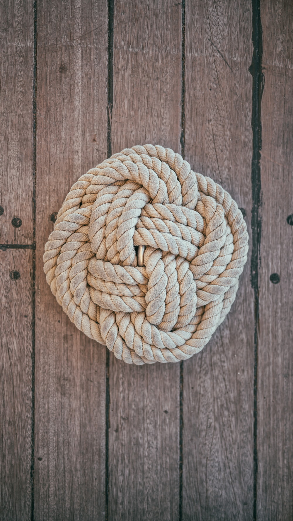 beige rope on brown surface