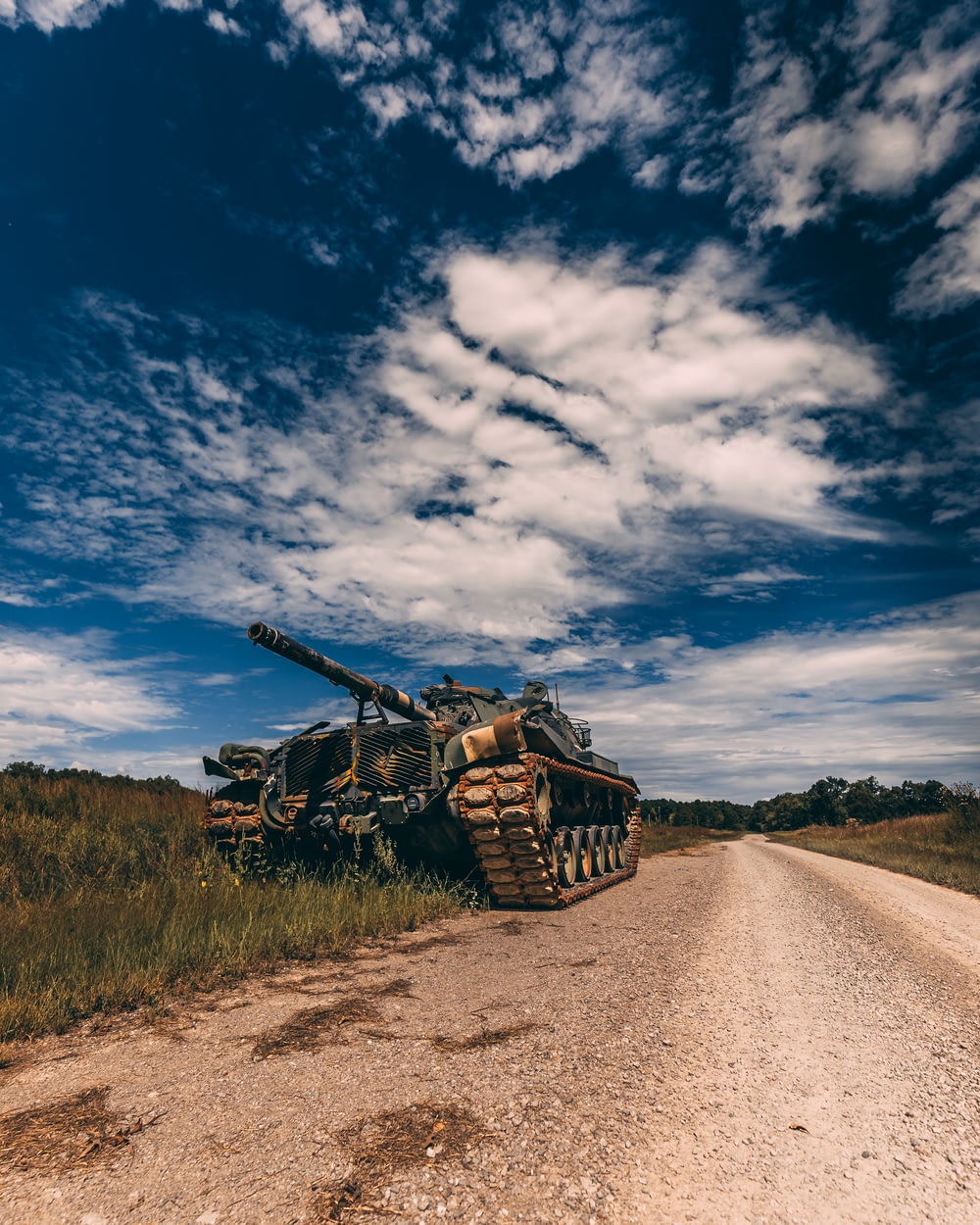 grey battle tank on road during daytime