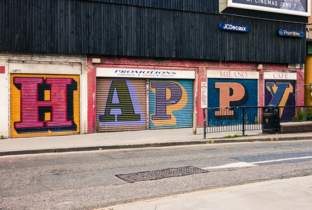multicolored HAPPY roll-up door graffiti
