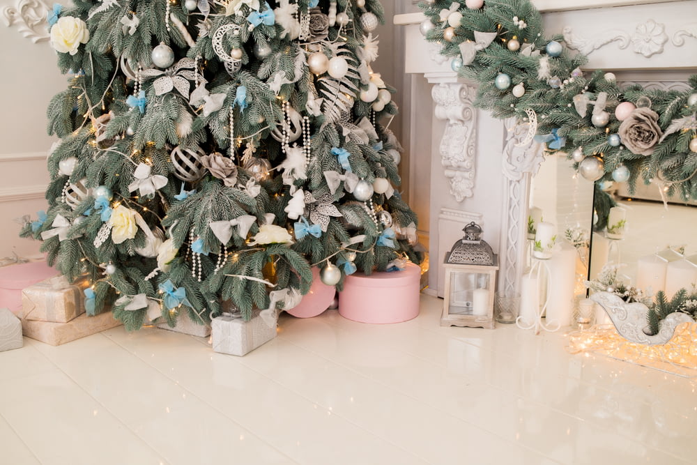 gray candle lantern beside Christmas tree