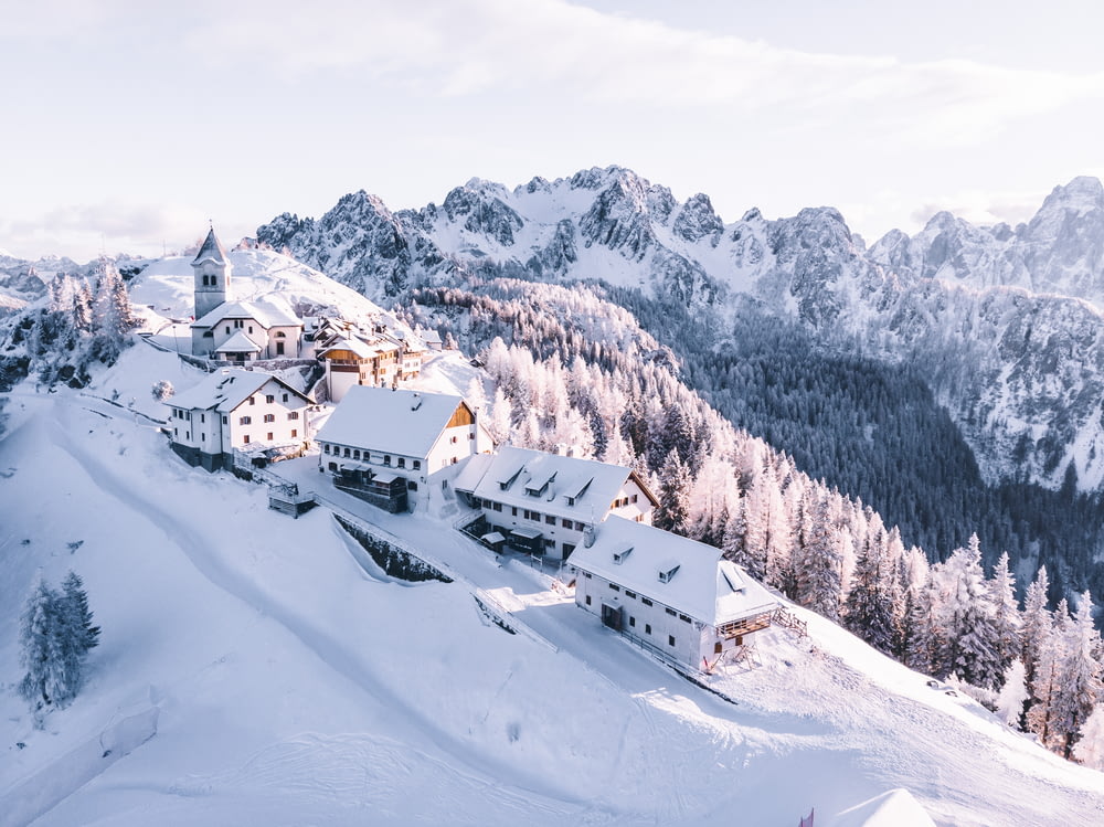 houses on mountain covered with snow