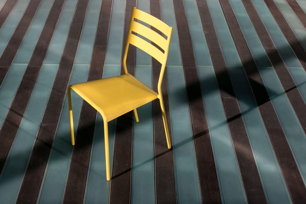 yellow armless chair