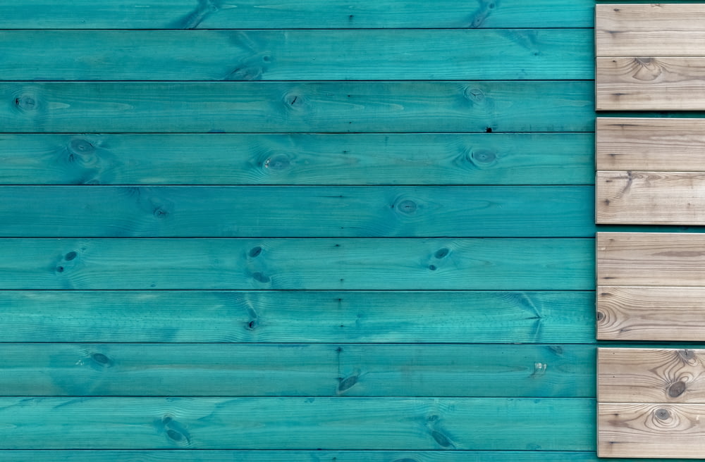teal and gray wooden panel