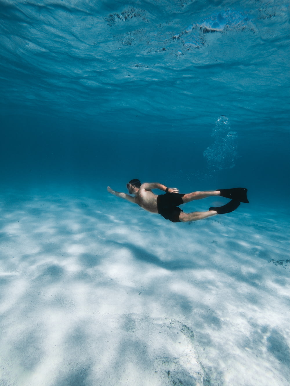 man swimming in water