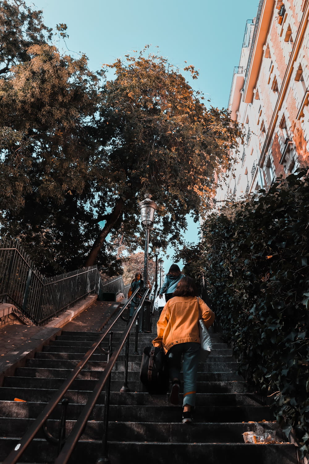 person walking on stair during daytime