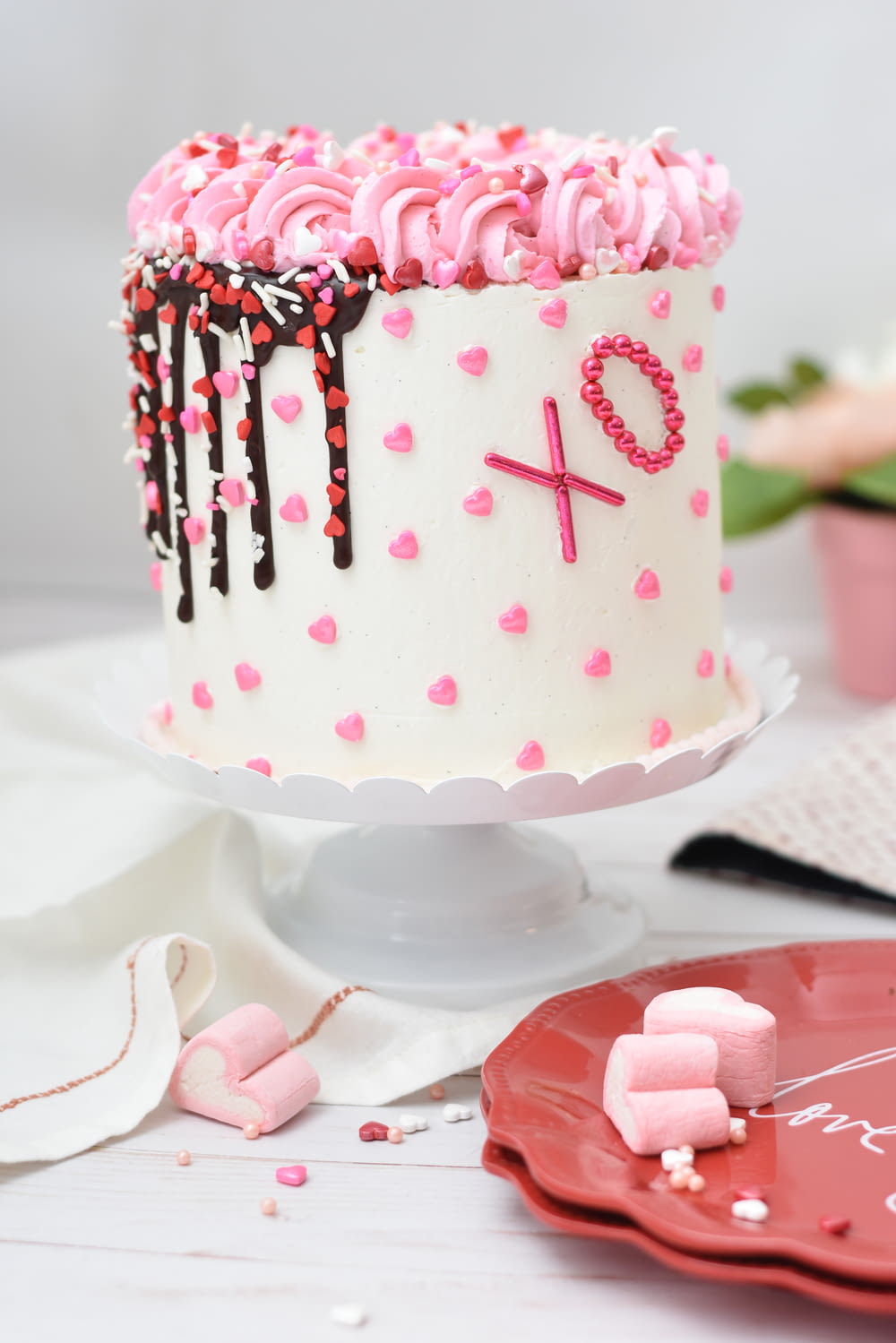 white and pink coated fondant cake
