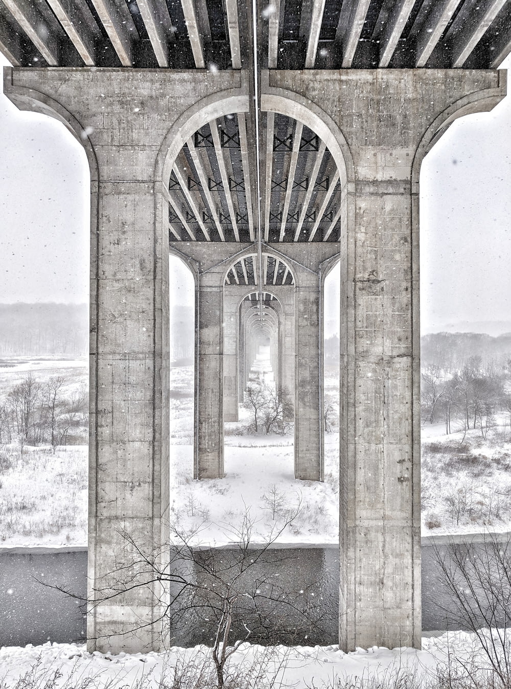 gray concrete bridge with snow