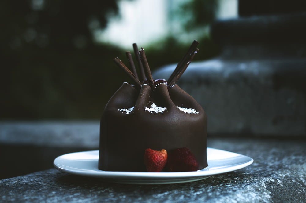 chocolate cake and strawberry on plate