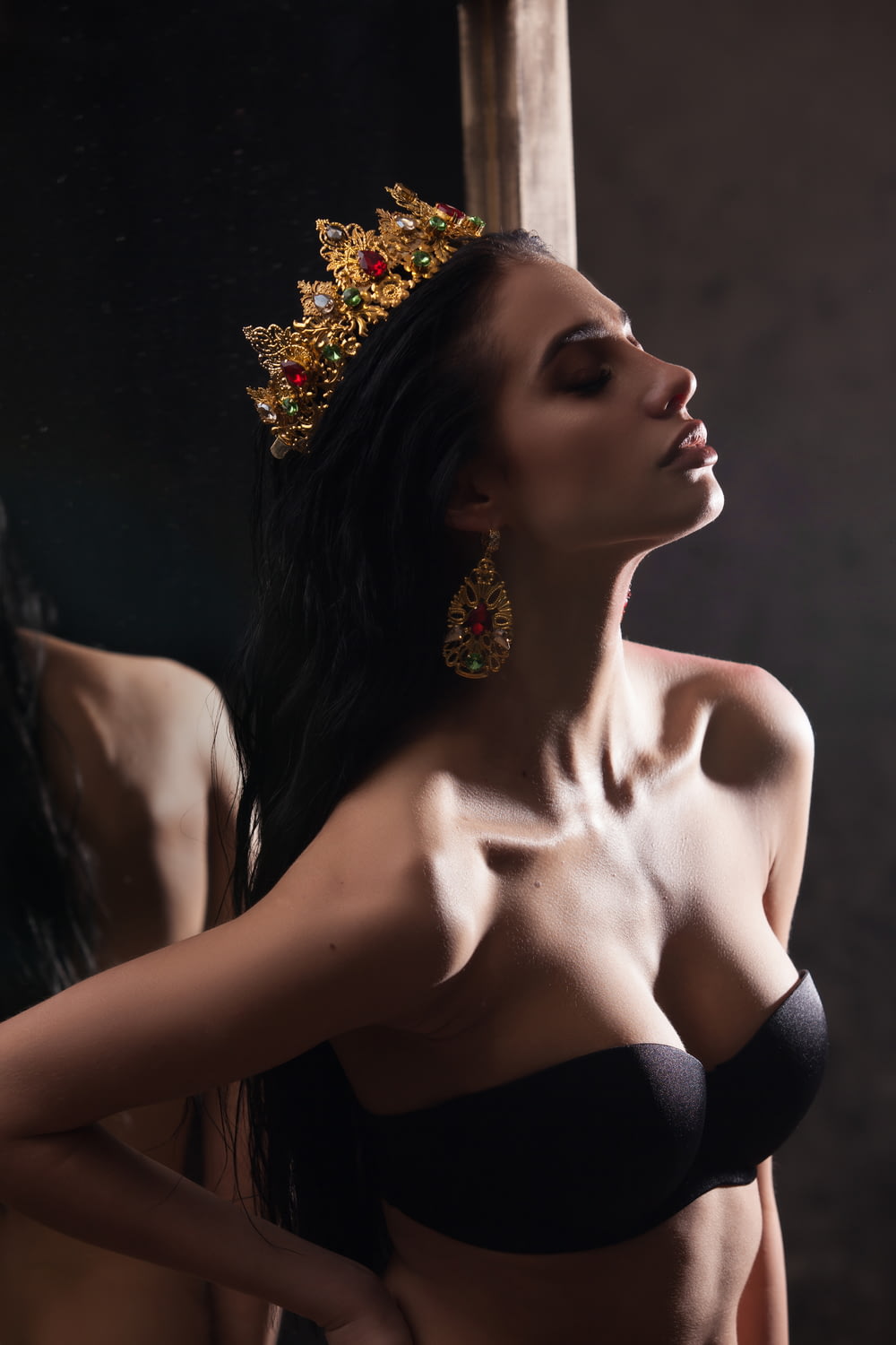woman in black brassiere and gold-colored crown