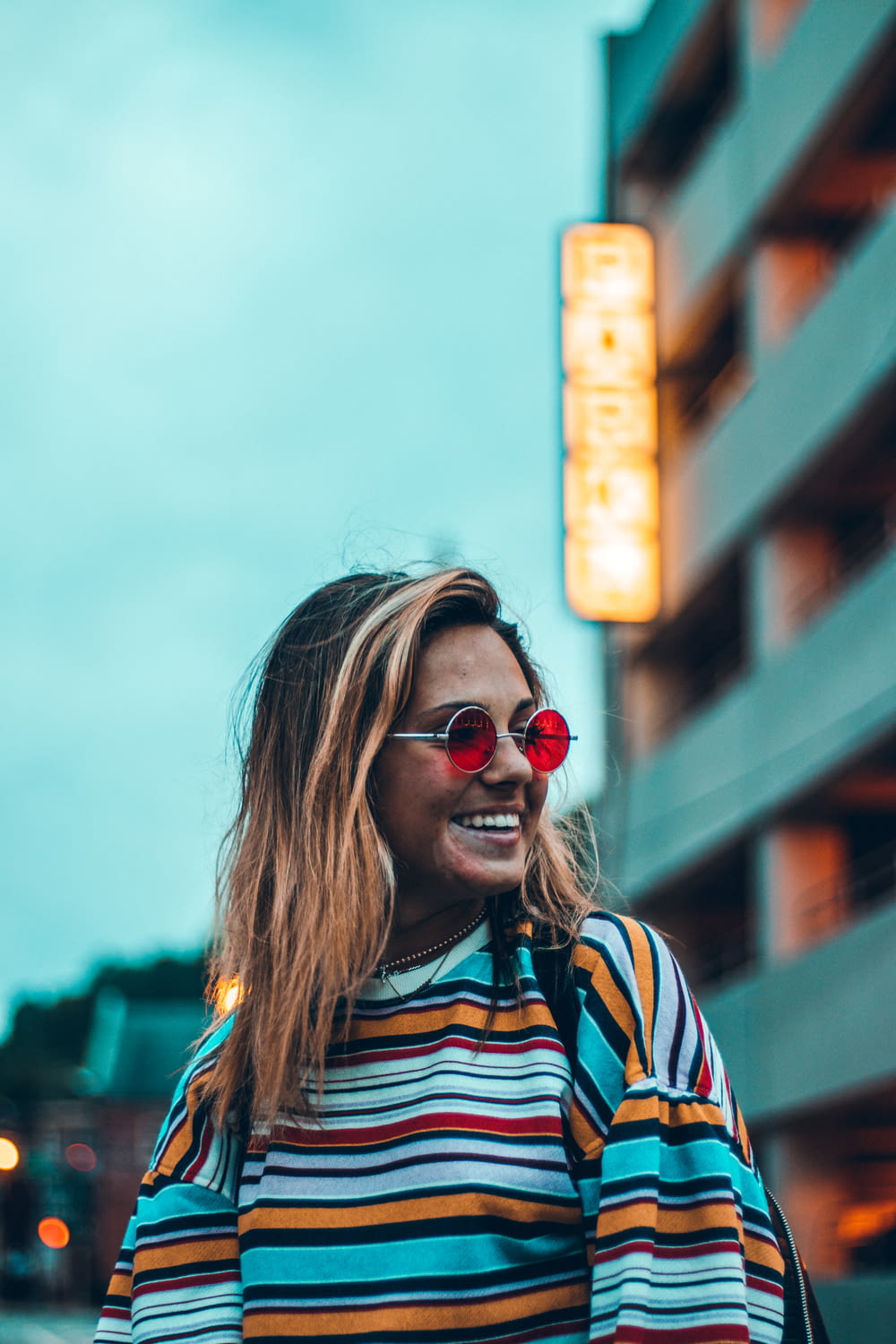 selective focus photography of woman wearing sunglasses