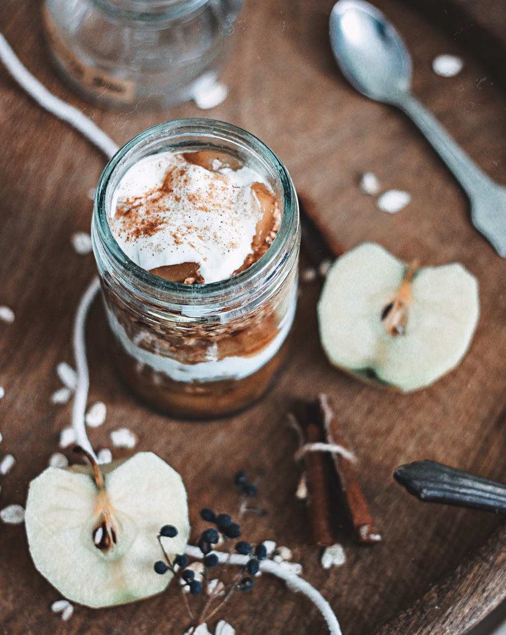 chocolate in clear glass jar near apple slices