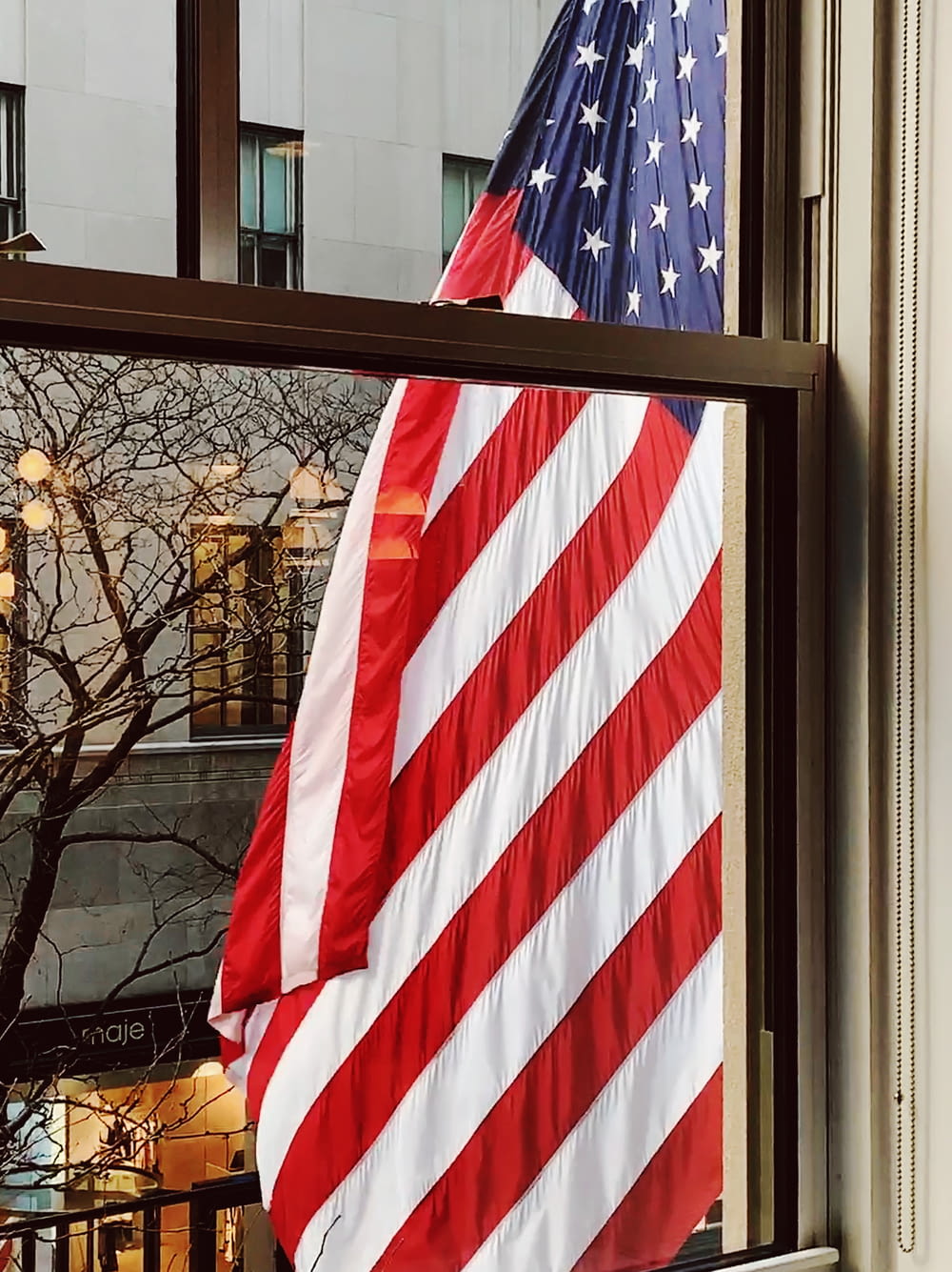American flag outside window