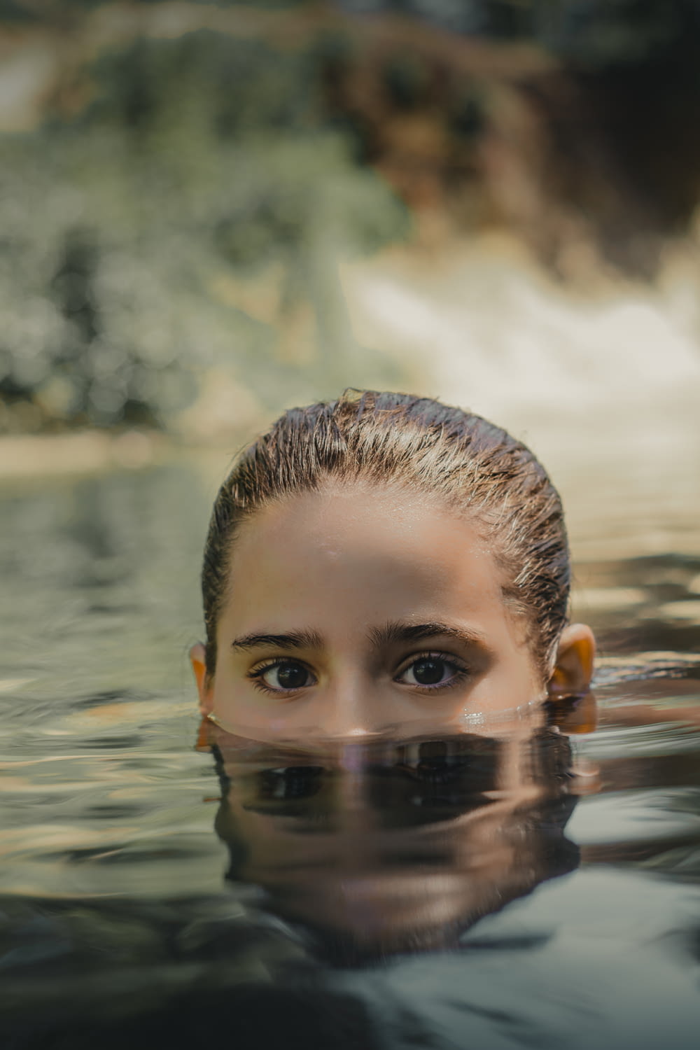woman soaking on body of water