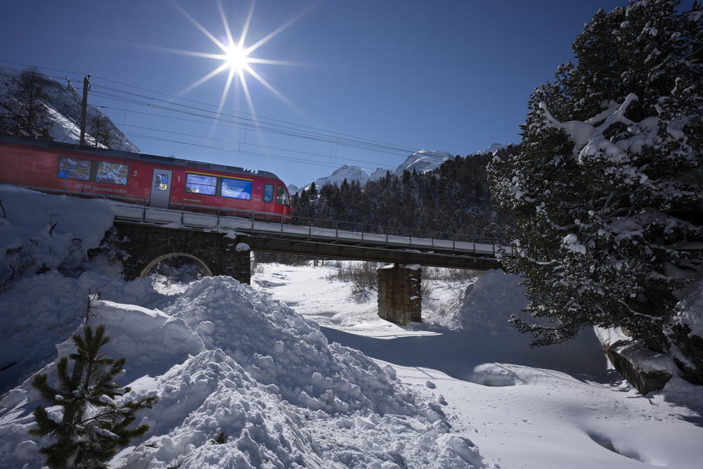 red train on railroad