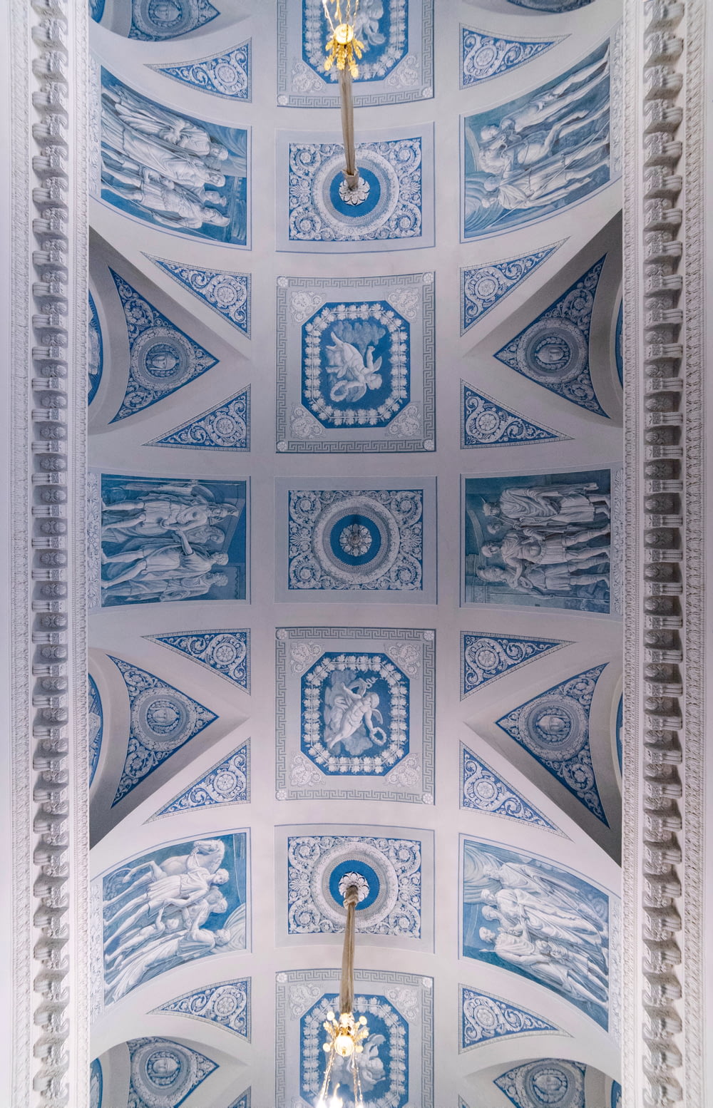 the ceiling of a church with a blue and white design