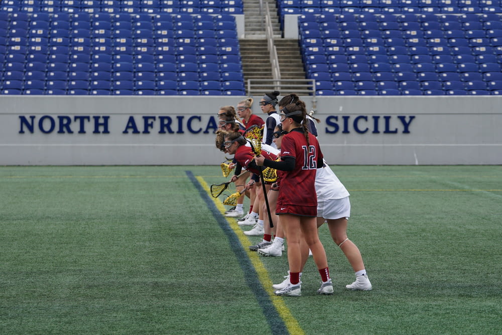 group of women playing lacrosse