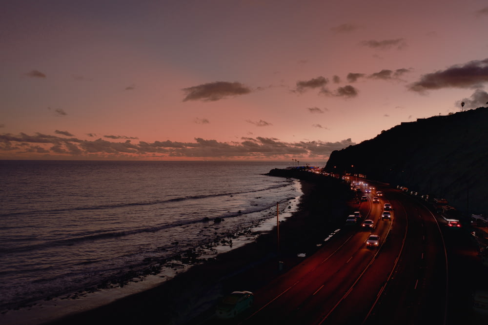 view of road with vehicles near coastline