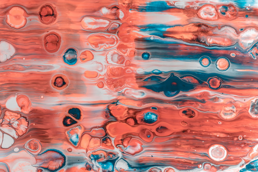 a close up of a red and blue painting