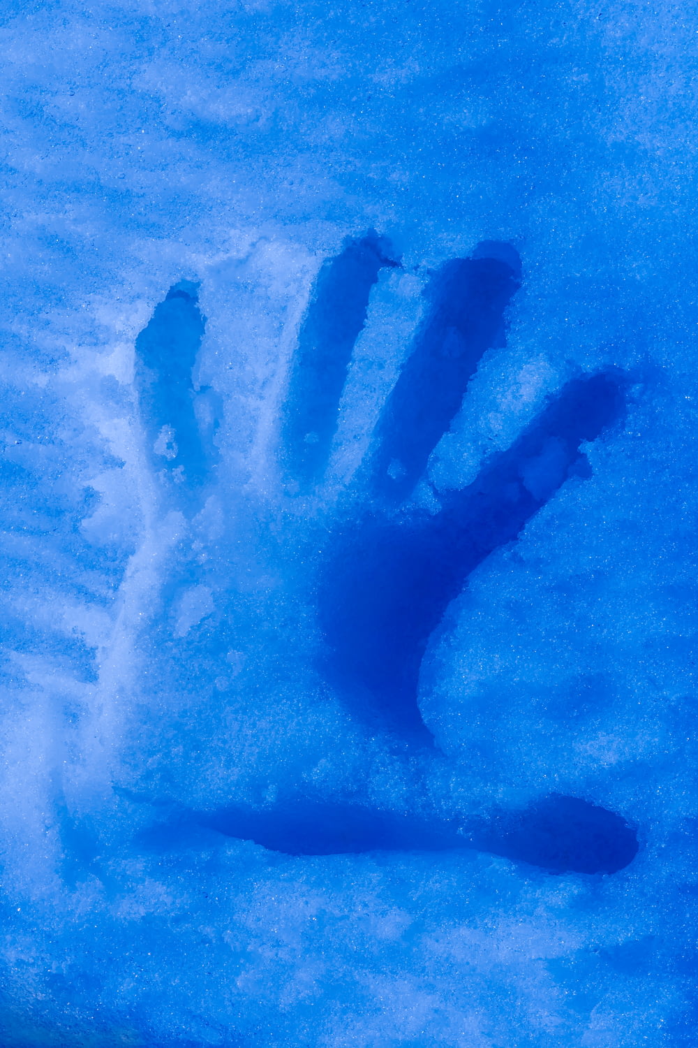 left hand on icy surface