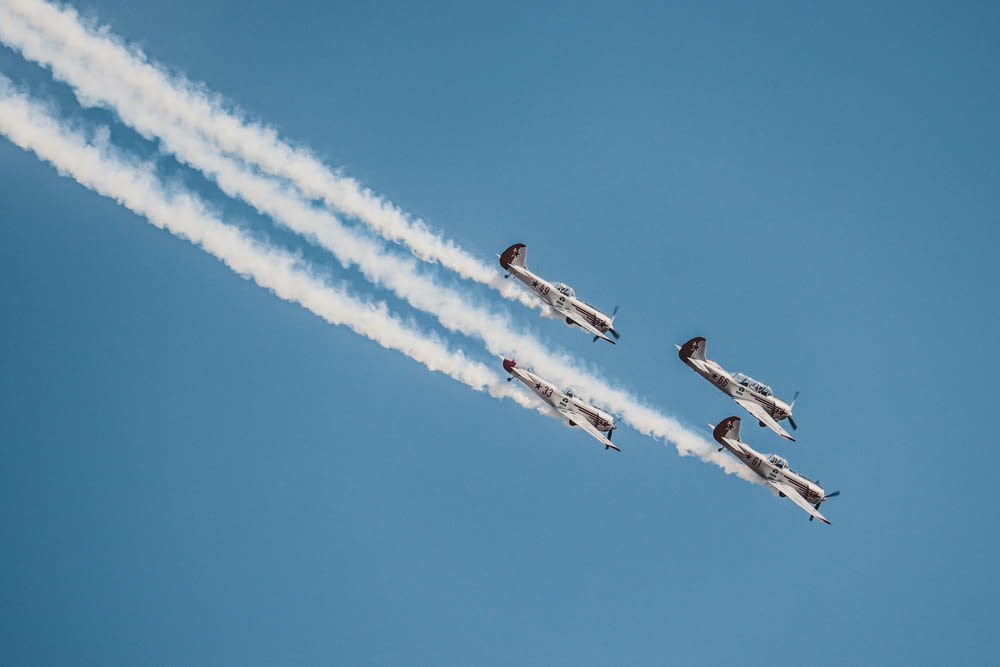 four gray jet planes