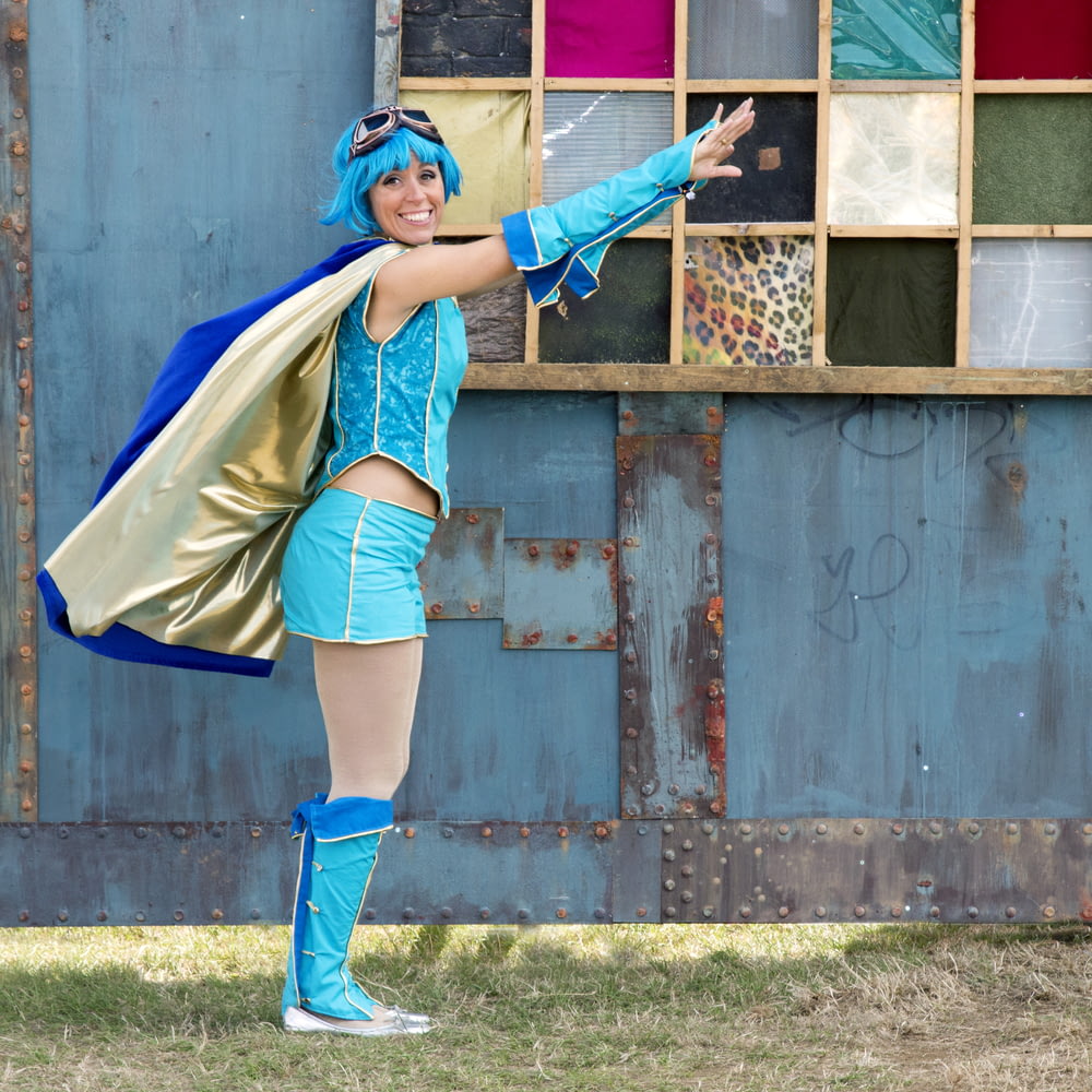 woman wearing anime costume about to fly position
