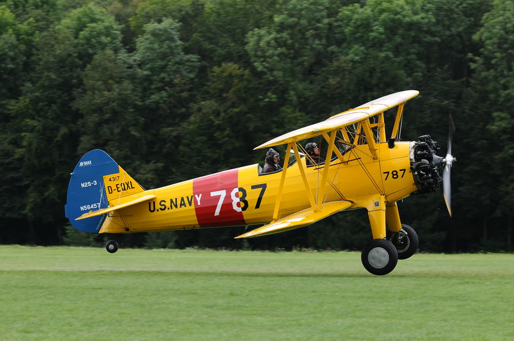 yellow, red, and blue biplane