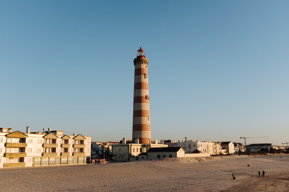 brown and white lighthouse under blue sky during daytime