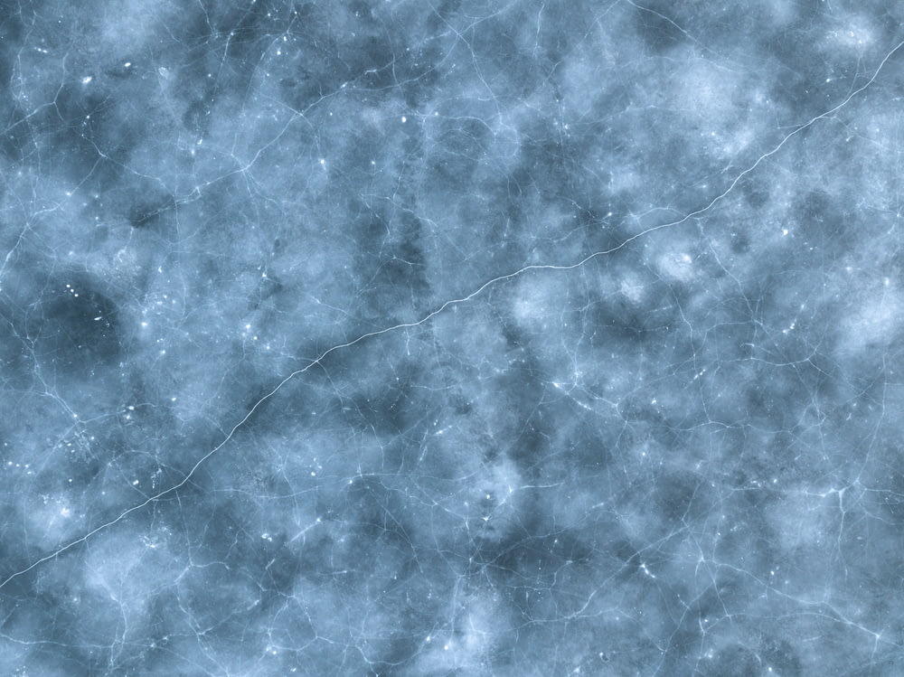 a blue and white textured background with small stars