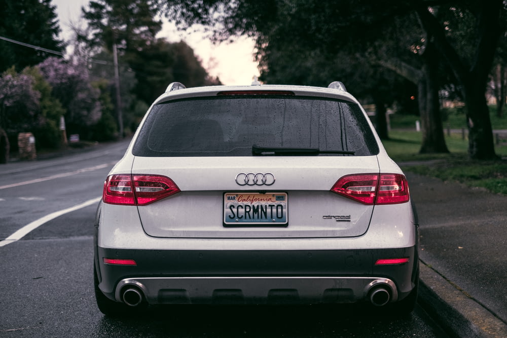 white Audi hatchback showing SCRMNTO plate