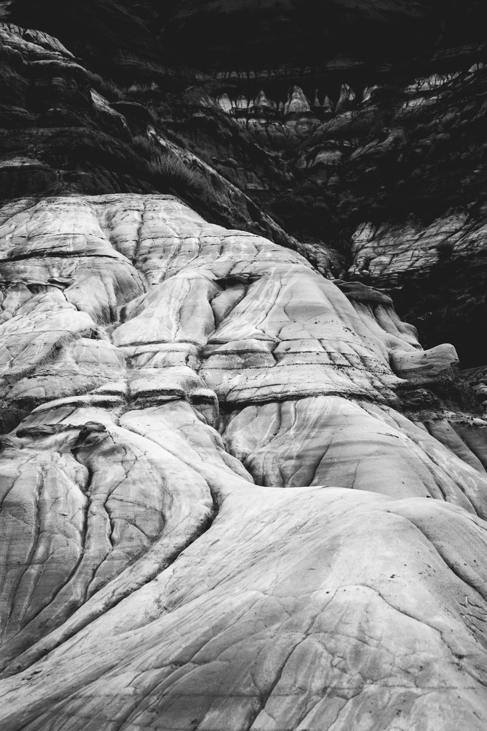 shallow focus of rock mountain in greyscale photography