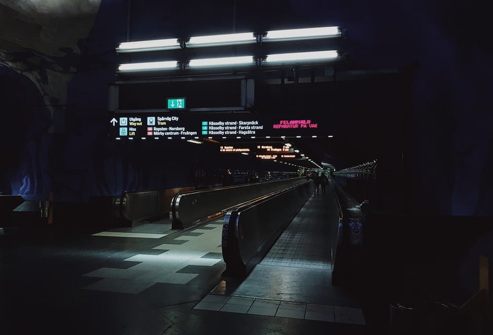 a subway station at night with lights on