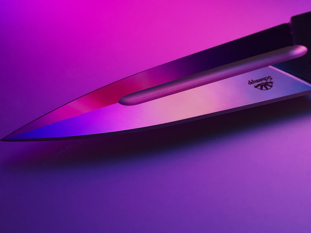 gray knife point on purple background