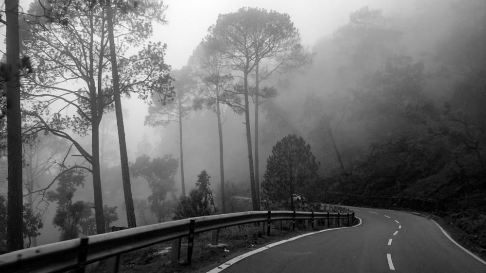 gray road beside mountain
