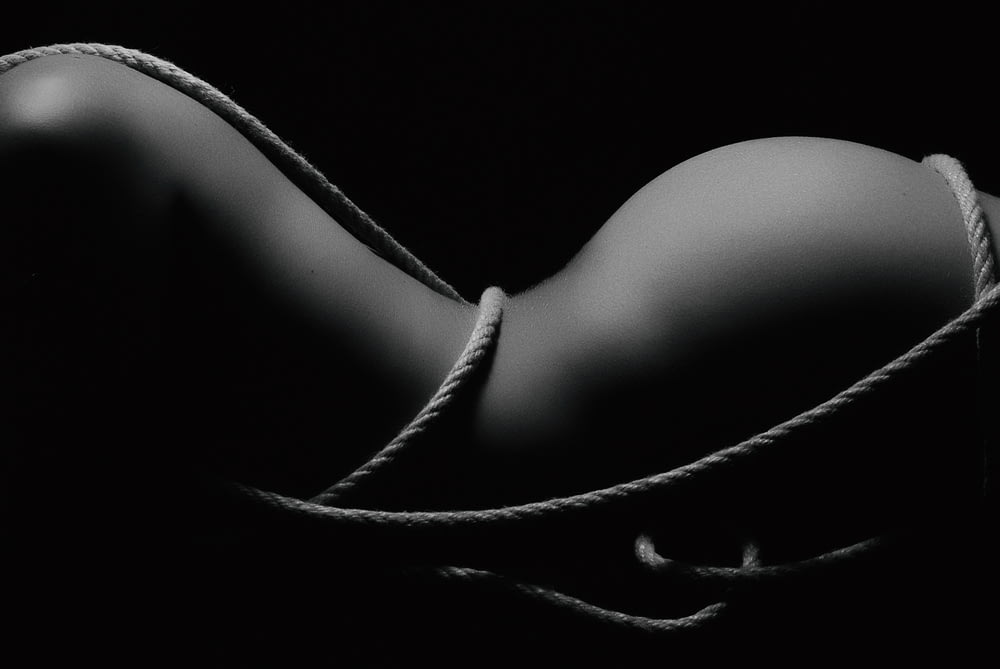 grayscale photography of naked woman covered with rope