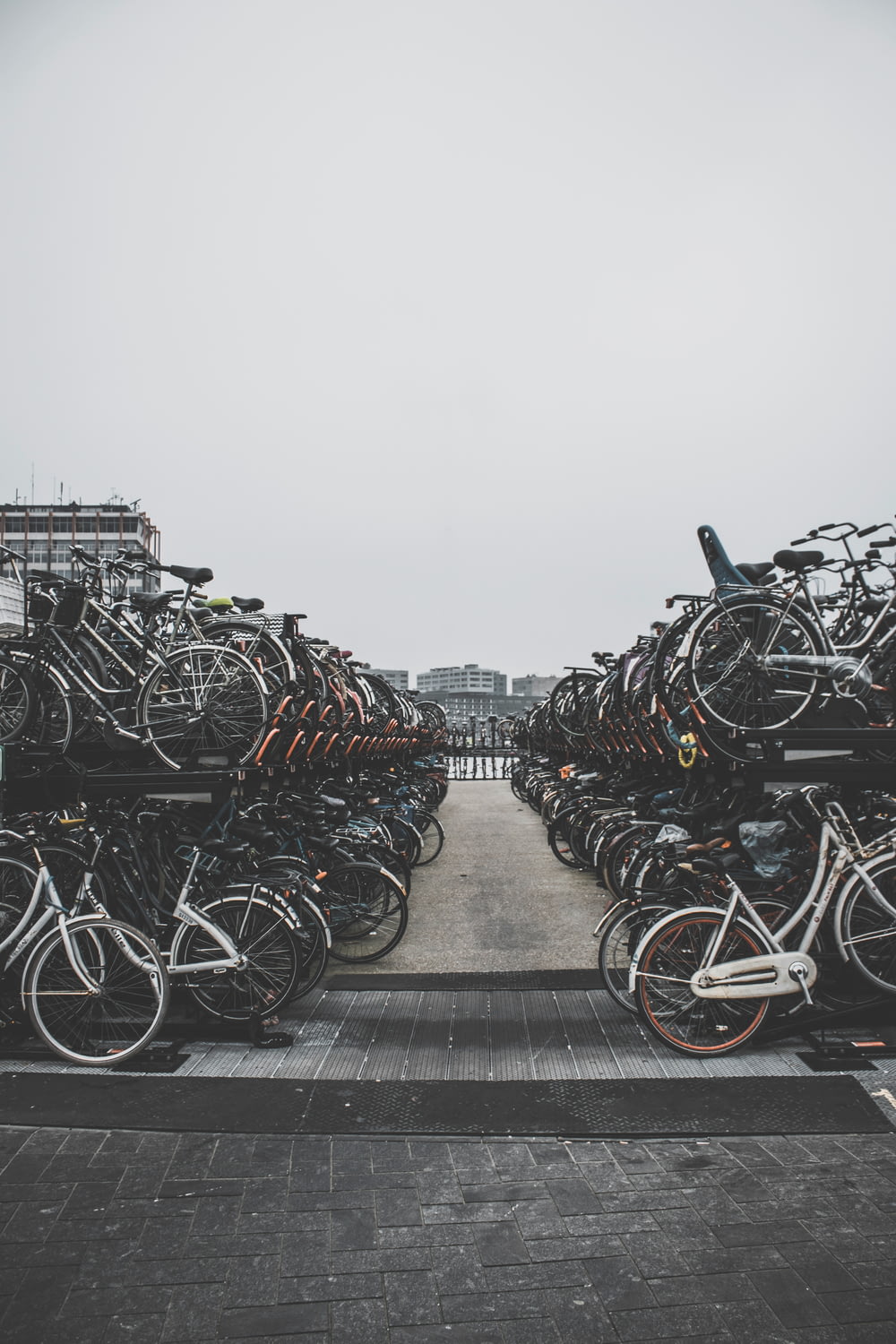 pile of bicycles outside during daytime