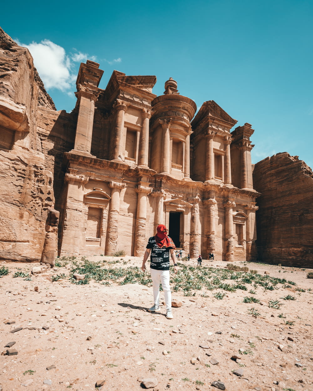 man standing beside Petra at daytime