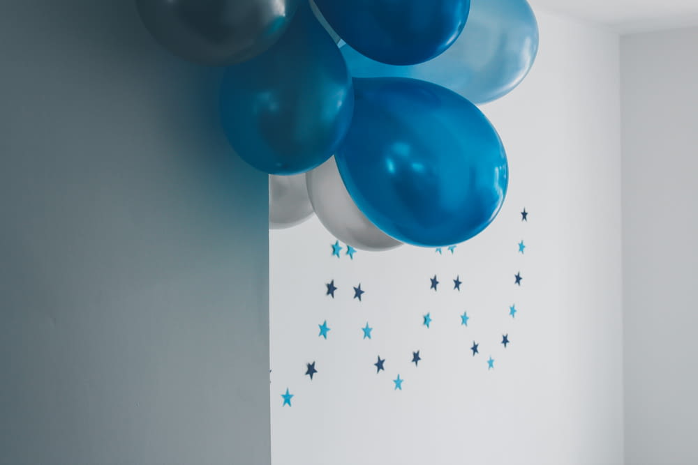 blue balloons hanging on wall