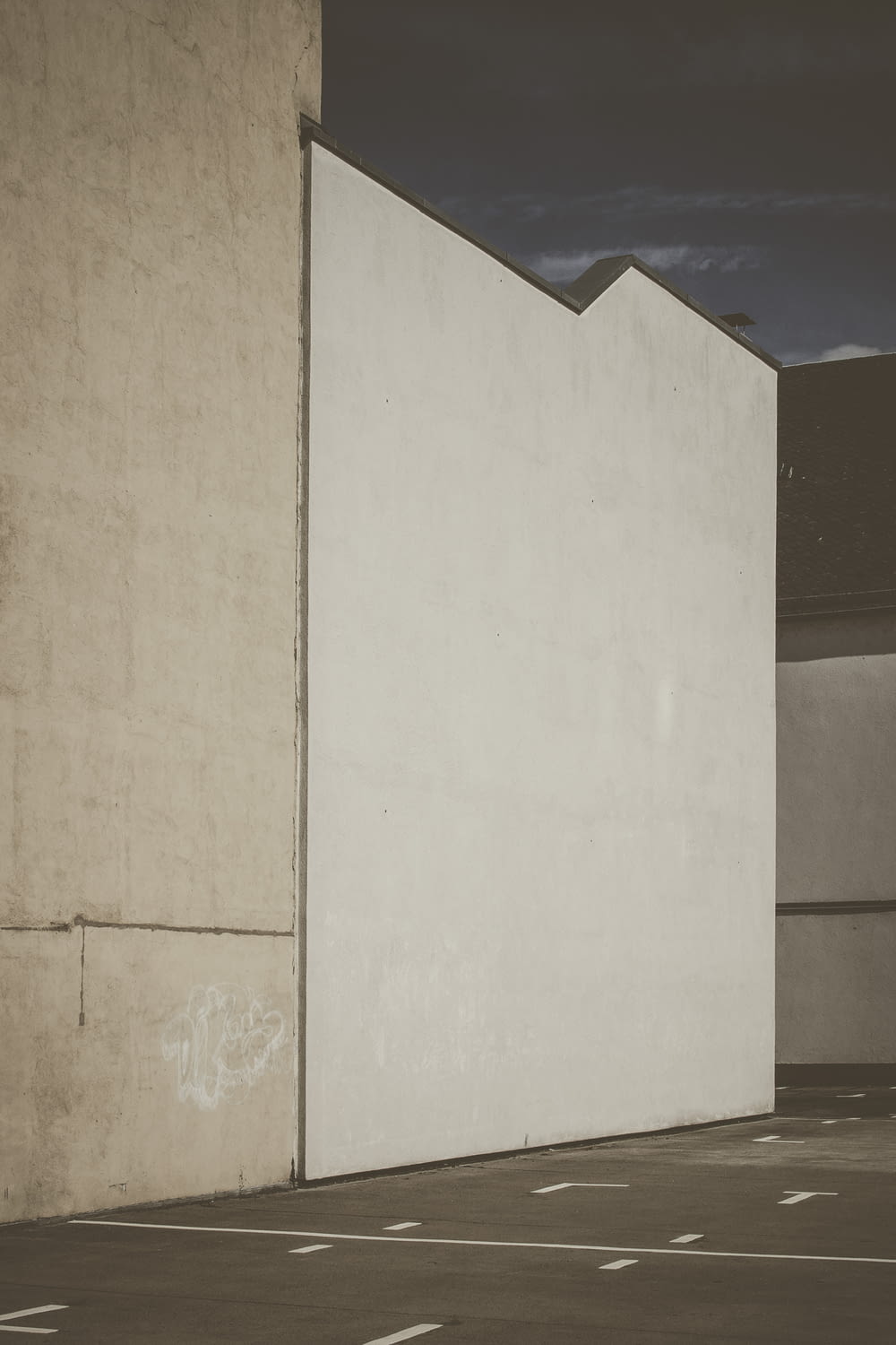 white painted concrete wall during daytime
