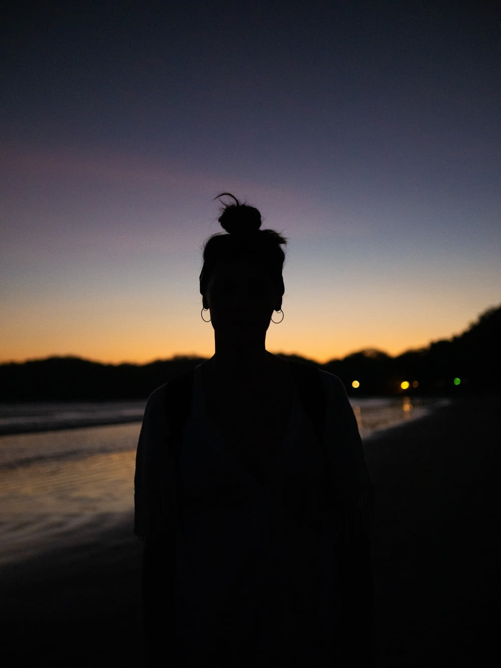 silhouette photography of person on shore