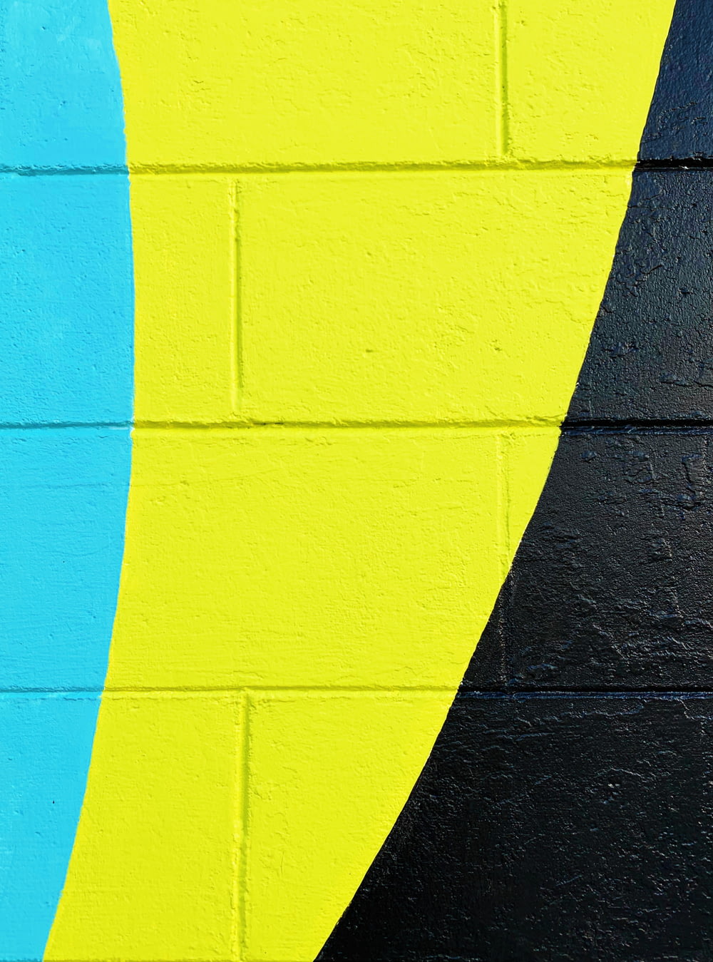 teal, yellow, and black painted wall