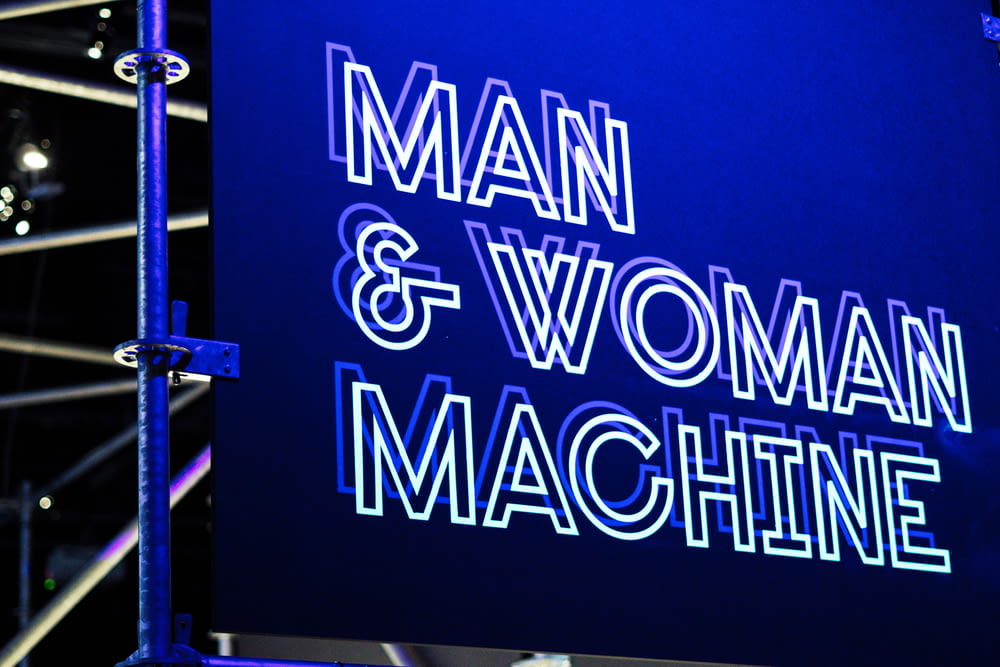 man and woman machine logo