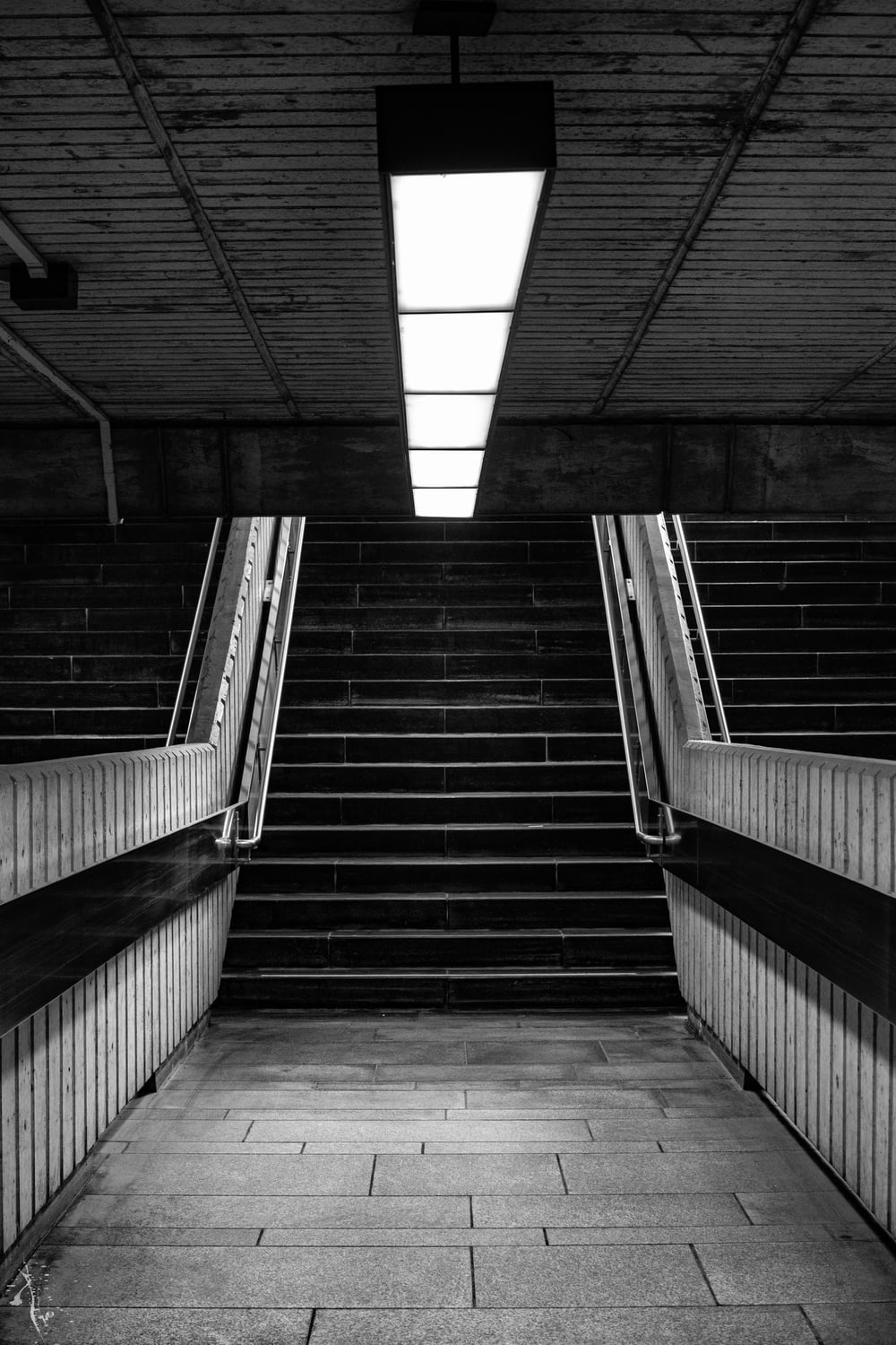 grayscale photography of subway stairs