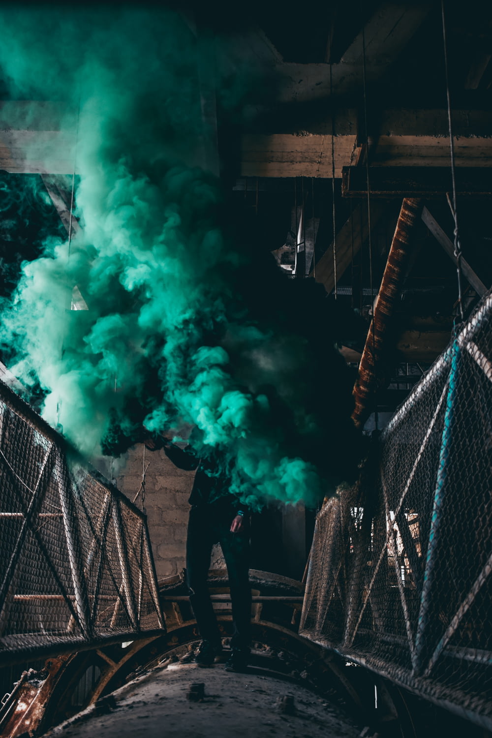 person standing in green smoke