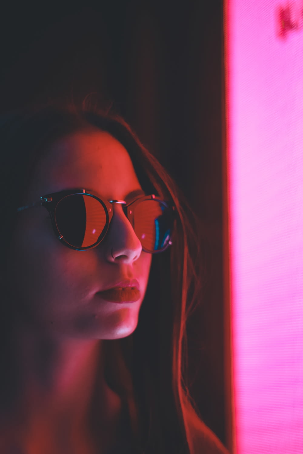 woman with sunglasses in room