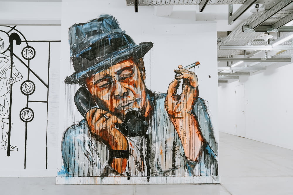 man holding telephone and cigarette painting