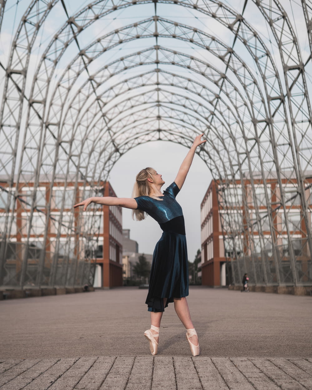 ballerina standing under arch
